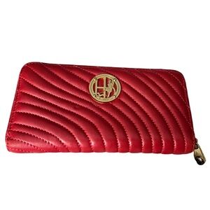 Henri Bendel red quilted wallet with a gold-tone logo.